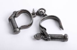 A pair of vintage handcuffs with key marked KE 2770, J.G.1952.