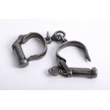A pair of vintage handcuffs with key marked KE 2770, J.G.1952.