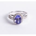 An 18ct Tanzanite and diamond ring set in white gold, size N.