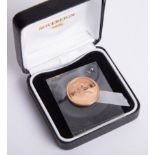 A 2000 QEII full gold sovereign, boxed.