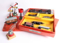 A collection of tinplate clockwork '0' gauge Hornby models including nine pieces of track, a boxed