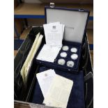 A large collection of silver proof coins and commemorative first day covers including 'Great