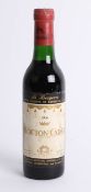 A half bottle of 1966 Mouton-Cadet red wine.