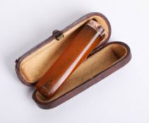 Victorian amber and gold mounted cig holder, cased.