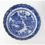 A Chinese Qianlong cobalt blue and white scallop shaped porcelain dish, diameter 12cm, with