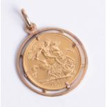 A 1974 full sovereign in a 9ct gold mount, approx. 10.4g.