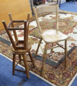 A pine high chair and two pine stools.