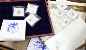 A collection of 37 miniature gold coins including '21st Century Gold Rarities' and 'U.S. History