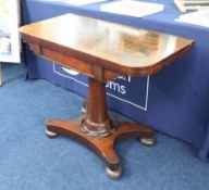 A 19th century mahogany fold over card table.