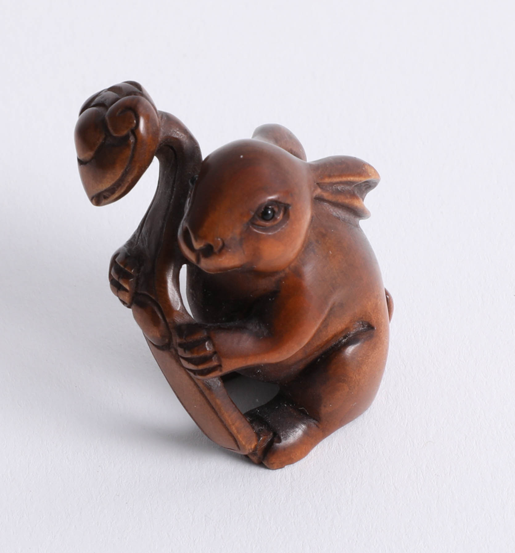 A carved wood netsuke, depicting a Hare.