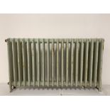 A large old cast iron radiator, previously from the old Plymouth City Museum, 77cm x 137cm.
