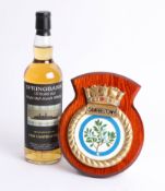 A bottle of ten year old Springbank Scotch whisky bottled for HMS Campbeltown, and a mounted