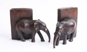 A pair of carved wooden elephant bookends.