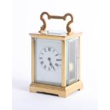 A brass cased carriage clock, with striking movement, gong, white dial with roman numerals, height
