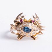 An 18ct ring in the form of a crab set with sapphire, ruby and diamonds, size O.
