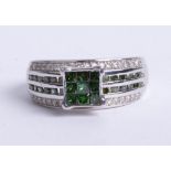 An 10k white gold green diamond ring, size N.