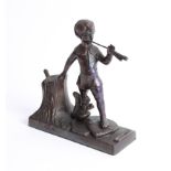 A striker, model in a form of 'Pan' bronze effect, height 19cm.