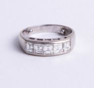 A 18ct white gold five stone princess cut diamond ring, size J.