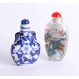 Two oriental perfume bottles, one depicting the Great Wall of China and the other depicting