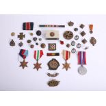 Box of various patches, badges and military items together with set of four WWII medals awarded to