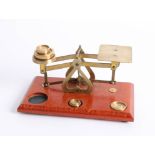 Set of small vintage postal scales and weights.