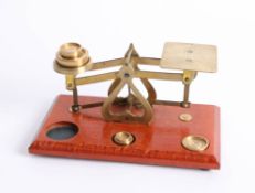 Set of small vintage postal scales and weights.