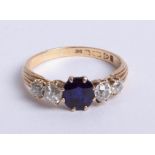 An 18ct diamond and sapphire ring, size P.