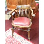 A vintage oak framed desk chair.