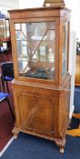 A mahogany glass display cabinet fitted with cupboard underneath, height 155cm.