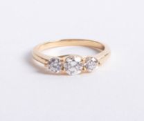 An 18ct gold and diamond trilogy ring approx 1.00ct, size M.