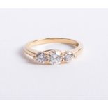 An 18ct gold and diamond trilogy ring approx 1.00ct, size M.