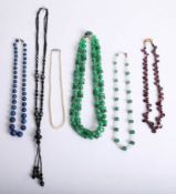 Collection of necklaces including malachite style and other coloured necklaces also jet.