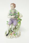 A 19th century Sitzendorf porcelain figure modelled as a Gardener, under Alfred Voigt, under glaze