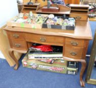 An oak writing desk, width 107cm.