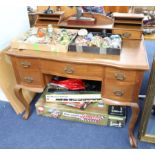 An oak writing desk, width 107cm.