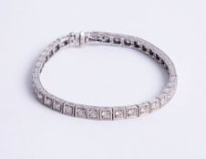 An 18k gold and diamond set bracelet, set with approx. 4 carats of diamond, assed colour J-K and