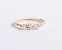 An 18ct gold and diamond trilogy ring approx 0.50ct, size M.