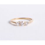 An 18ct gold and diamond trilogy ring approx 0.50ct, size M.