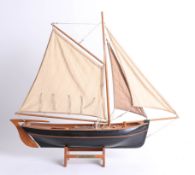 A wooden model of the 'The Hooker' Fishing Boat.