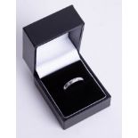 An 18ct white gold and diamond band ring, size M.
