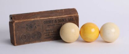 Three ivory billiard balls, made by Orme & Sons, Ltd.