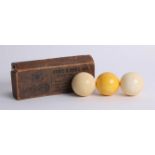 Three ivory billiard balls, made by Orme & Sons, Ltd.