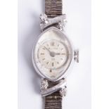 A 14k ladies white gold Bulova wristwatch, approx. 19.6g.