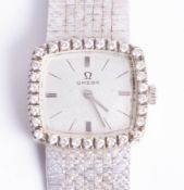 Omega, a ladies 18k white gold and diamond wristwatch.