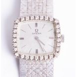 Omega, a ladies 18k white gold and diamond wristwatch.