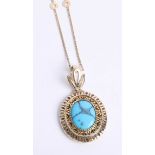 A 14k turquoise set pendant on an 18ct chain pendant, size 35mm x 29mm.