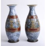 A pair of Doulton art pottery vases, height 28cm.