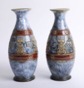 A pair of Doulton art pottery vases, height 28cm.