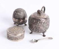An Indian white metal pepper pot, sugar pot, and trinket box. (3)