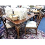 A mahogany dining table with four chairs, also another chair, height 135cm.